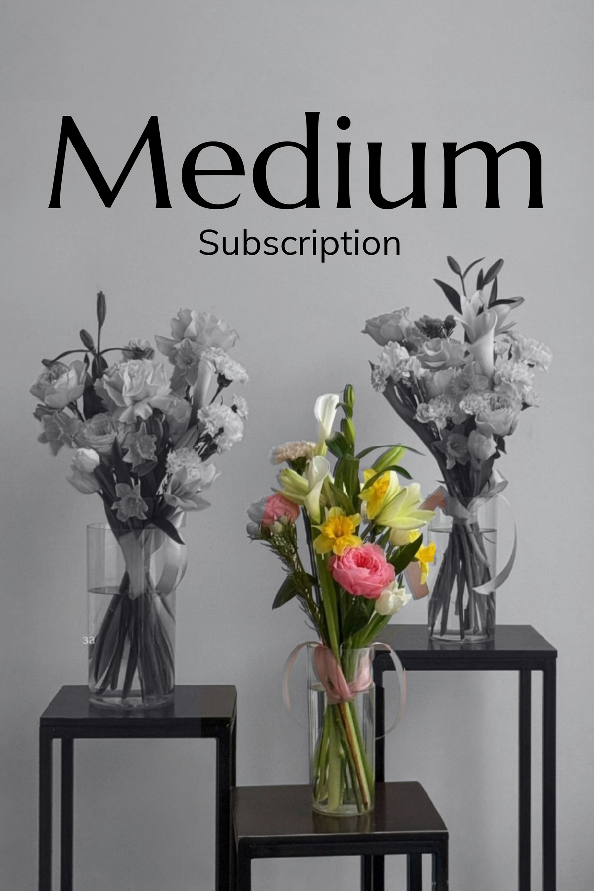 A promotional graphic for a 'Medium Subscription' featuring three flower bouquets displayed on black metal side tables against a light gray wall. The left and right bouquets are in grayscale, while the center bouquet is in full color, showing pink roses, yellow lilies, and white tulips.